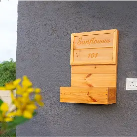 Sunflower-themed luxury wooden cottage at Varuwoods nature resort