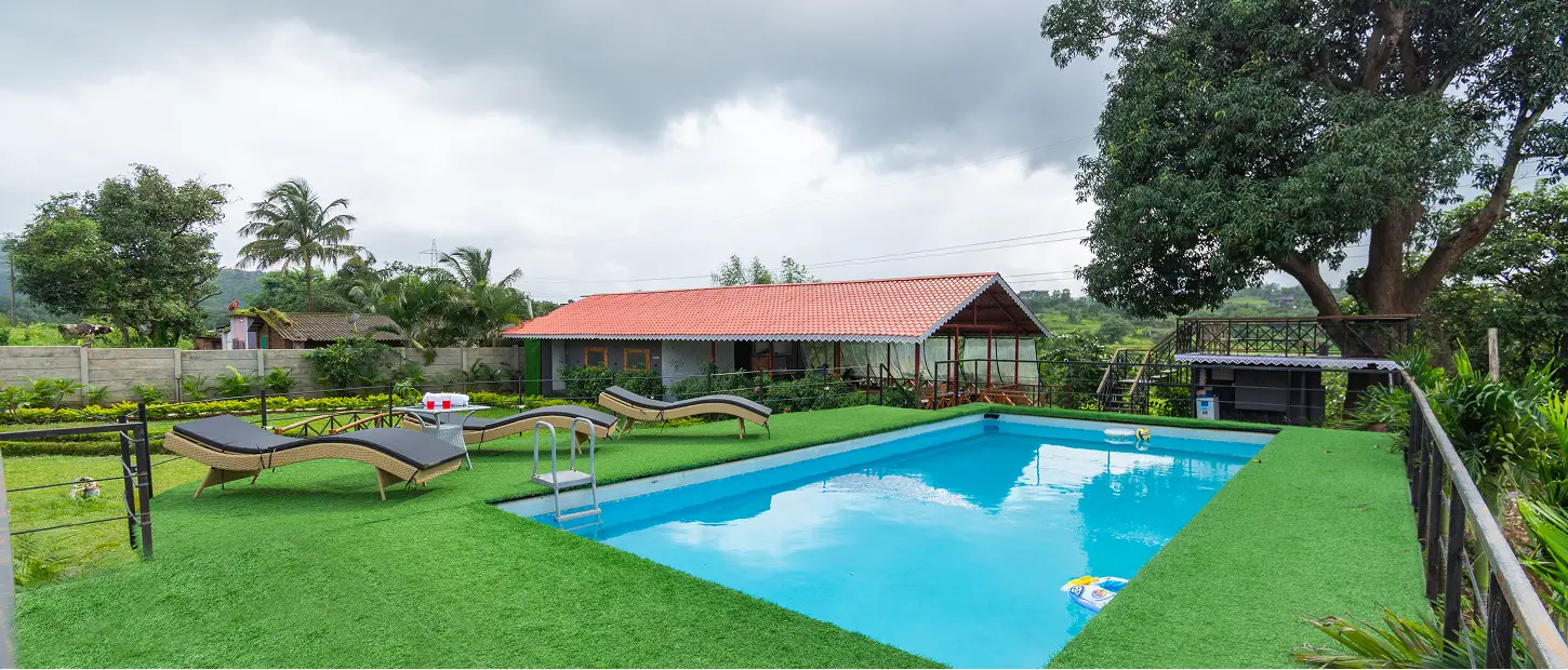 Swimming pool surrounded by nature at Varuwoods resort